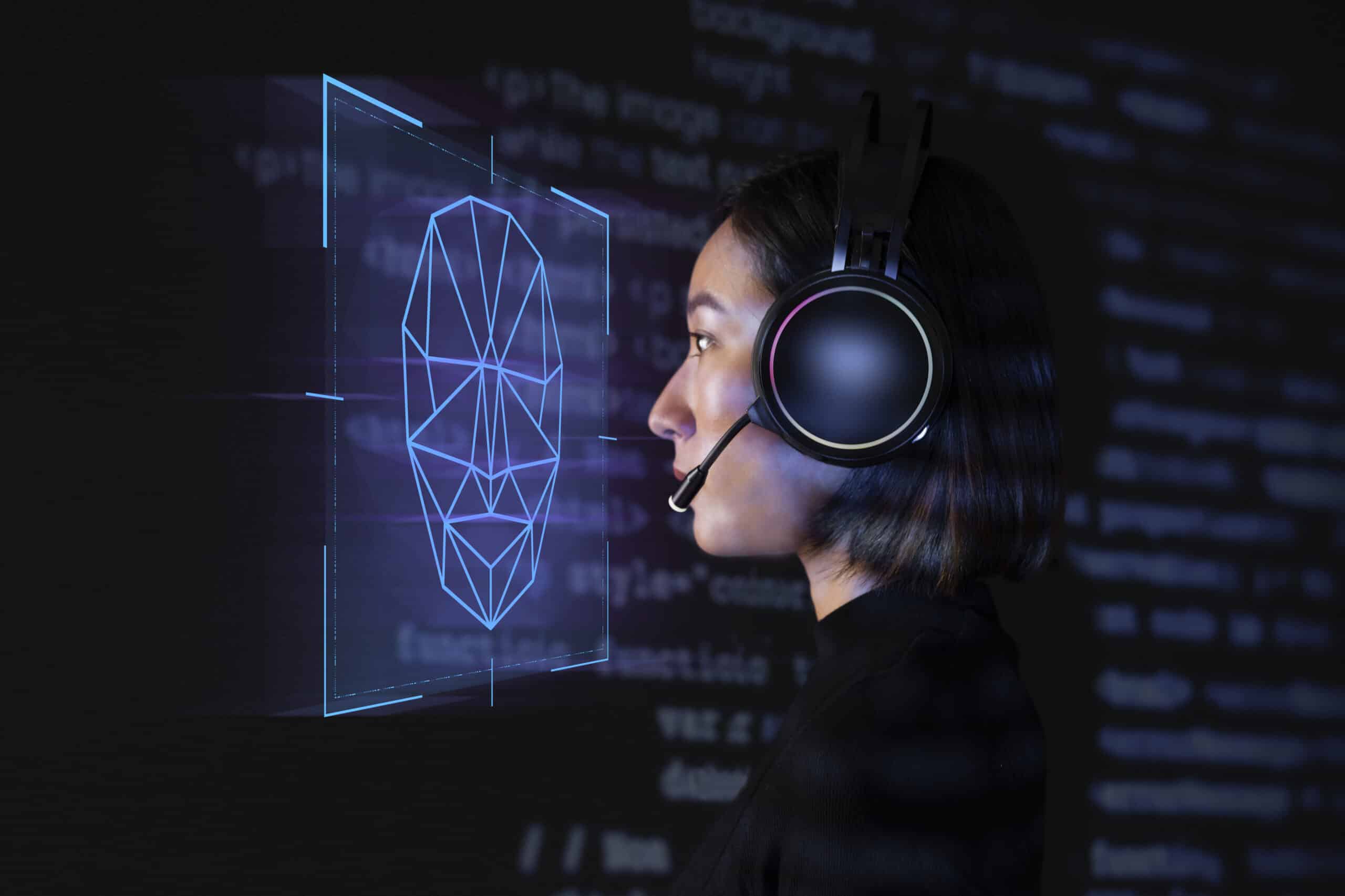 Female programmer scanning her face with biometric security tech